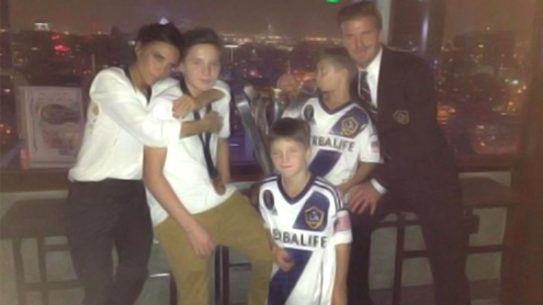 David Beckham lavishes Victoria with kisses and cuddles following his final LA Galaxy game