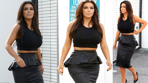 Kim Kardashian bursts over the waistline in a too-tight leather peplum skirt