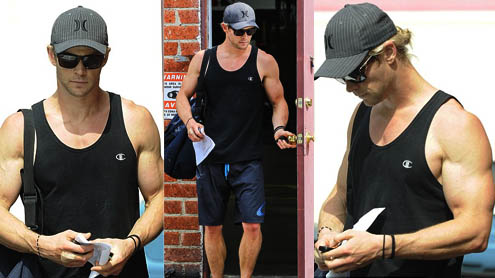 Chris Hemsworth shows off his bulging biceps as he leaves the gym