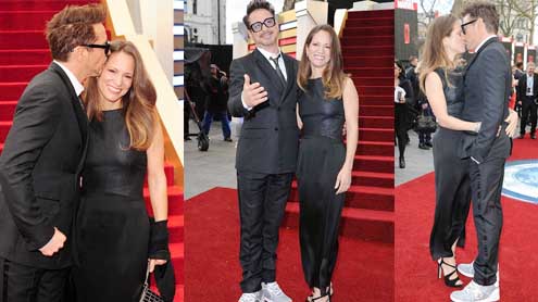 Robert Downey Jr passionately kisses his wife at Iron Man 3 premiere
