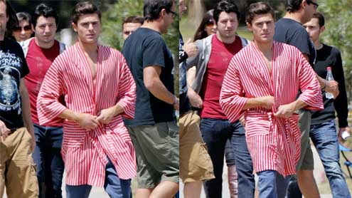 Zac Efron reveals his super toned chest in a striped robe